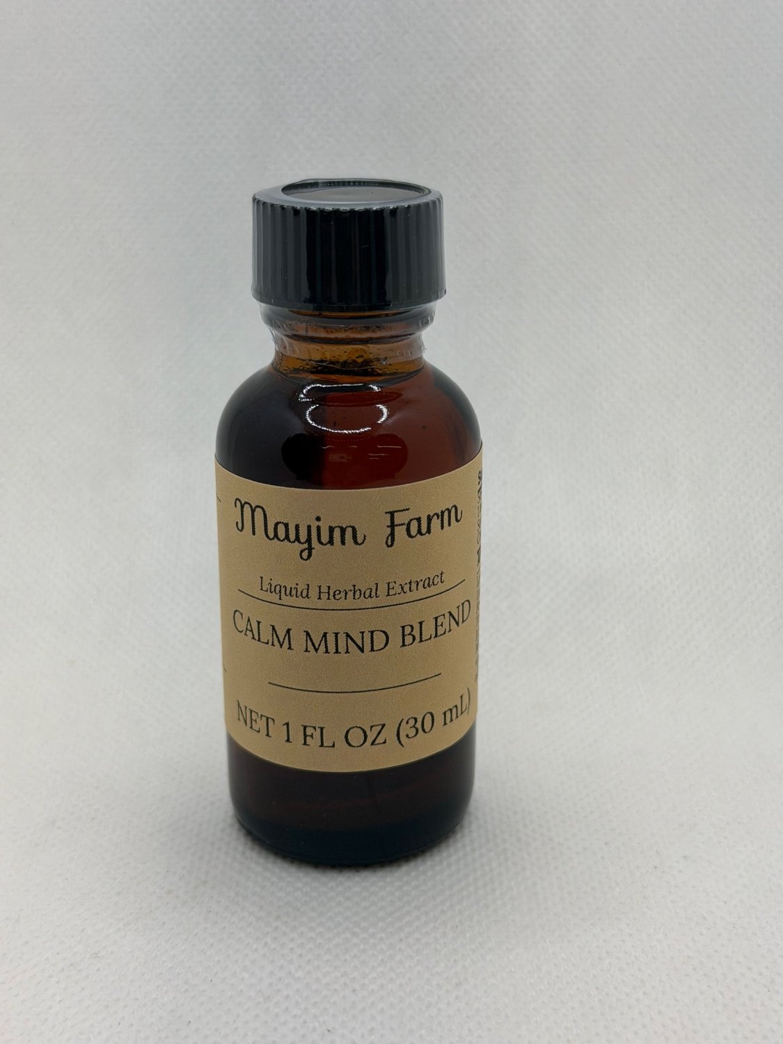 Calm Mind Blend, front of the amber glass bottle, a liquid herbal extract made at Mayim Farm in Opp, Alabama