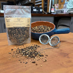 Chai Tea in a 1 oz pouch with a bowl of loose black tea, whole chai spices and a tea ball strainer, hand packed in Opp, Alabama