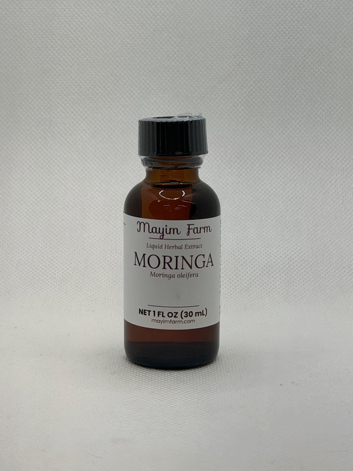 Moringa Leaf Extract, 1 fl oz amber glass bottle, liquid herbal extract from moringa grown on Mayim Farm in Opp, Alabama