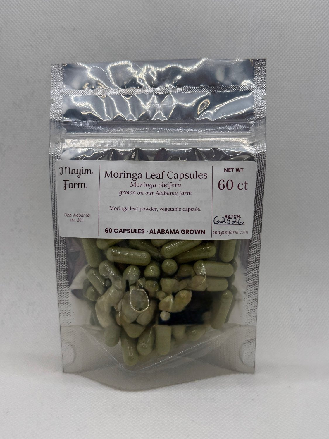 Moringa Leaf Capsules pouch front, filled with moringa grown at Mayim Farm in Opp, Alabama